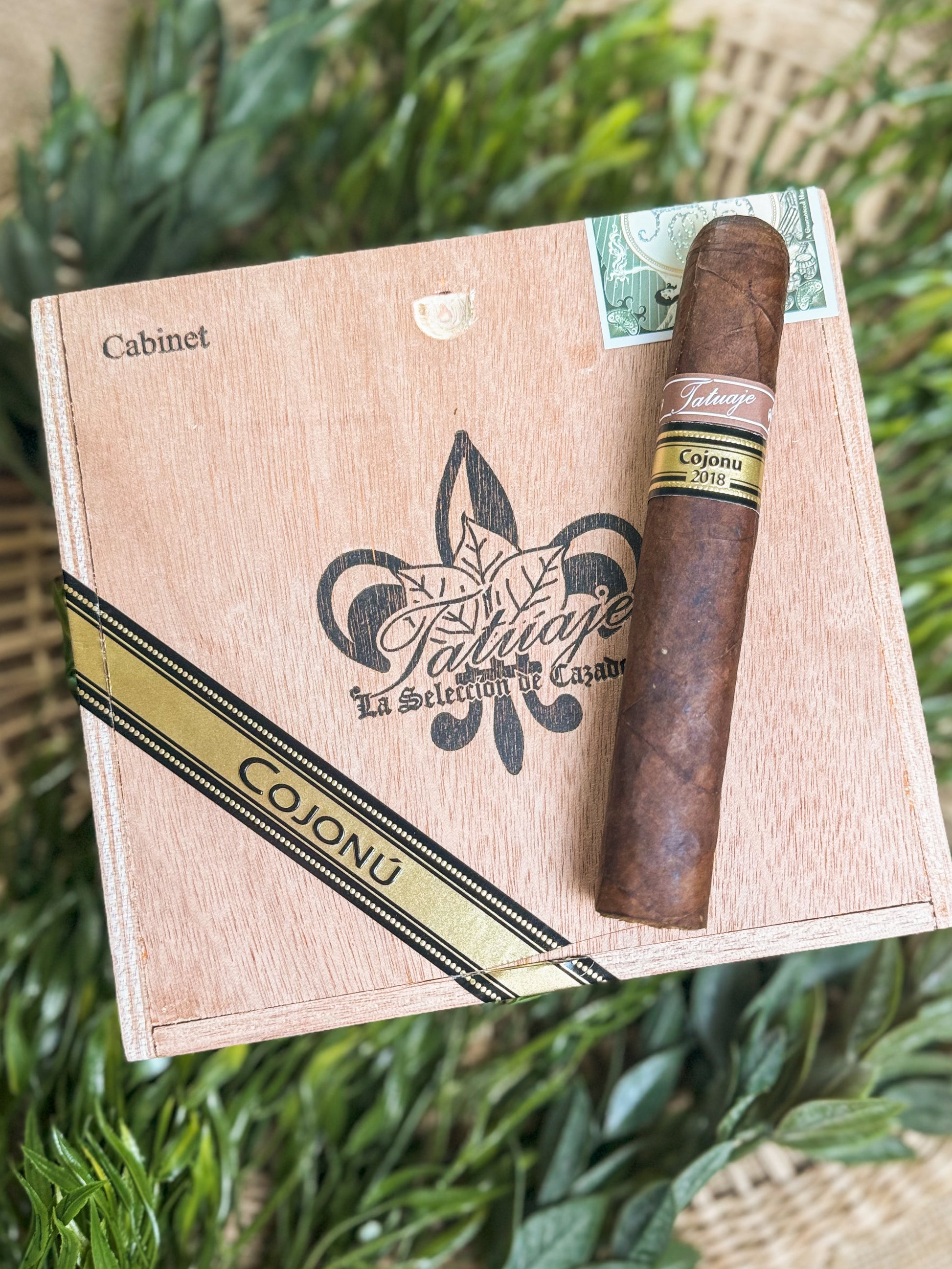 Tatuaje Cojonu 2018 resting on box