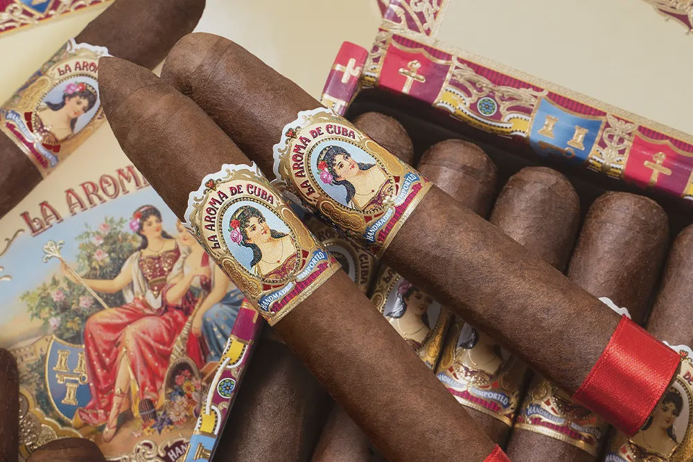 Packaged cigars with decorative bands featuring a woman's portrait and colorful design.