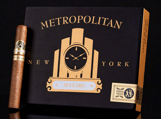 Cigar and Metropolitan New York cigar box with clock design on a black background