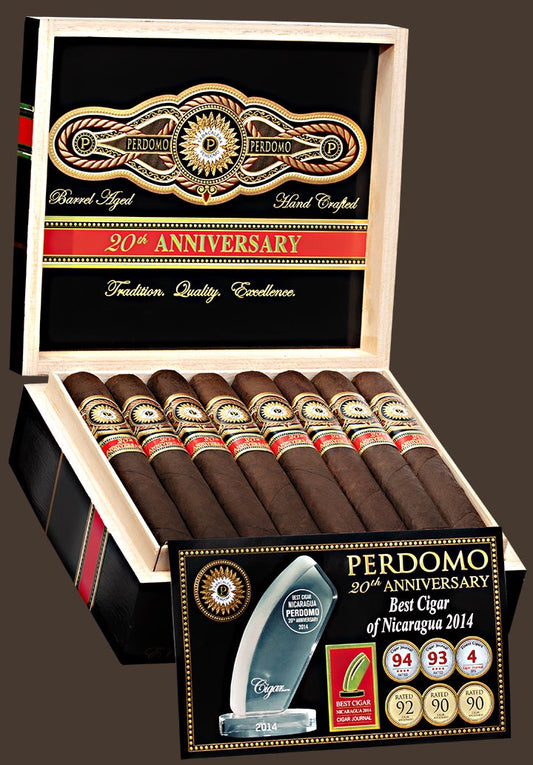 A box of PERDOMO 20th Anniversary Maduro cigars, displaying multiple cigars with bands and a trophy inside the box.